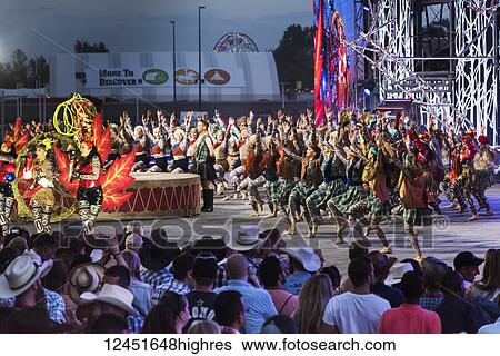 Stock Photograph - Dancers entertaining a crowd at the Calgary Stampede; Calgary, Alberta, Canada. Fotosearch