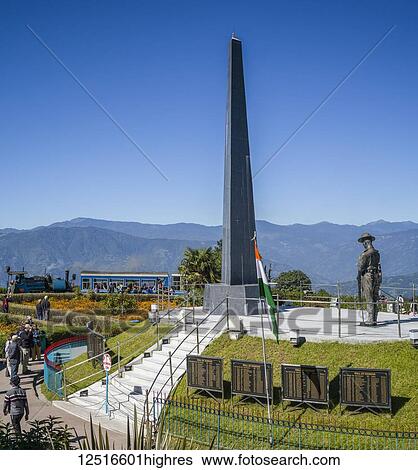 Stock Photograph - Darjeeling Toy Train and war memorial, The Darjeeling Himalayan Railway; Darjeeling, West Bengal, India. Fotosearch
