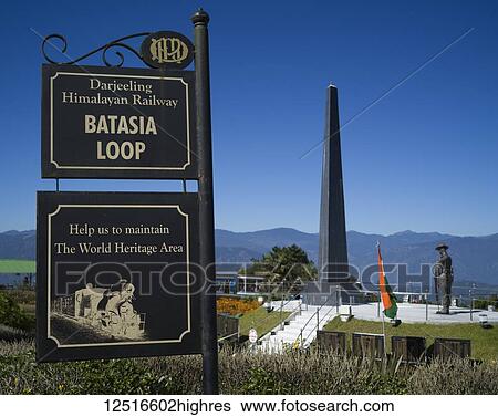 Stock Photograph - Darjeeling Toy Train and war memorial, The Darjeeling Himalayan Railway; Darjeeling, West Bengal, India. Fotosearch