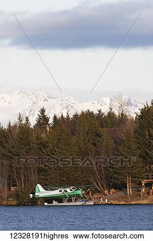 Stock Photograph - De Havilland Beaver Moored On A Lake Shore, Alaska, USA. Fotosearch