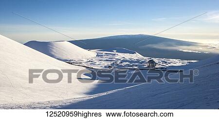 Stock Photograph - Decommissioned Caltech Submillimeter Observatory atop Mauna Kea with view to Mauna Loa; Island of Hawaii, Hawaii, United States of America. Fotosearch