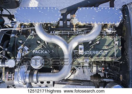 Detail of Packard Thunderbolt Straight 8 engine as powerful classic of the 1950s as seen in a spectator car at Bonneville Speed Week; Wendover, Utah, United States of America View Large Photo Image Stock Photograph - Detail of Packard Thunderbolt Straight 8 engine as powerful classic of the 1950s as seen in a spectator car at Bonneville Speed Week; Wendover, Utah, United States of America. Fotosearch