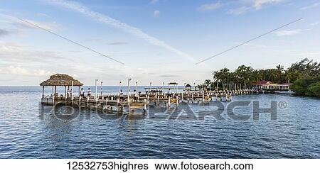 Docks at a resort on Turneffe Island in the Caribbean; Turneffe Island, Belize View Large Photo Image Stock Photograph - Docks at a resort on Turneffe Island in the Caribbean; Turneffe Island, Belize. Fotosearch