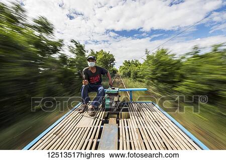 Driver on the Norry, the bamboo train; Battambang, Cambodia View Large Photo Image Stock Photograph - Driver on the Norry, the bamboo train; Battambang, Cambodia. Fotosearch