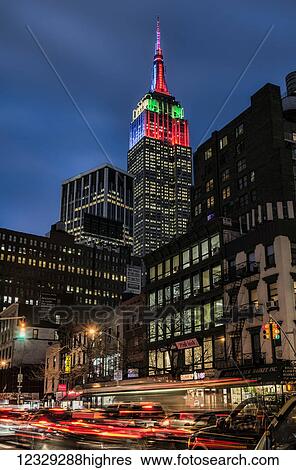 Stock Photograph - Empire State Building In Christmas And Hanukkah Colours; New York City, New York, United States Of America. Fotosearch