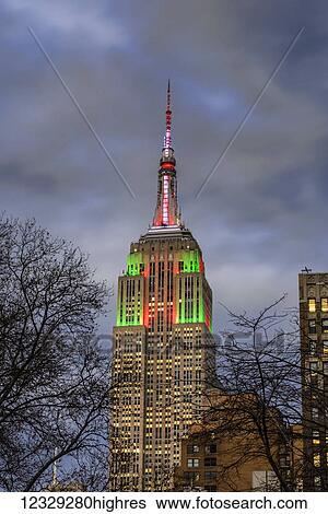 Stock Photograph - Empire State Building In Christmas Colours; New York City, New York, United States Of America. Fotosearch