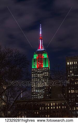 Stock Photograph - Empire State Building In Christmas Colours; New York City, New York, United States Of America. Fotosearch
