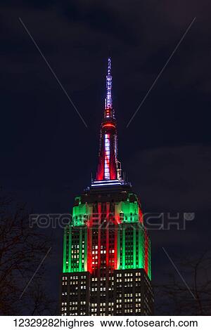 Stock Photograph - Empire State Building In Christmas Colours; New York City, New York, United States Of America. Fotosearch