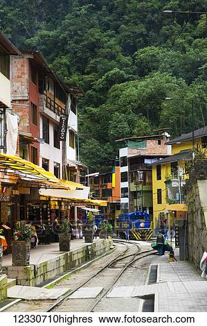 Stock Photograph - End Of The Train Tracks In Downtown Aquas Calientes, Gateway To Machu Picchu; Aguas Calientes, Cuzco, Peru. Fotosearch