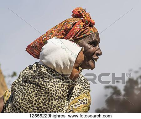 Eritrean woman holding a baby; Arbaroba, Central Province, Eritrea View Large Photo Image Stock Photograph - Eritrean woman holding a baby; Arbaroba, Central Province, Eritrea. Fotosearch