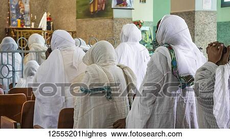 Stock Photograph - Eritrean women in white hijabs at the Enda Mariam Cathedral; Asmara, Central Region, Eritrea. Fotosearch