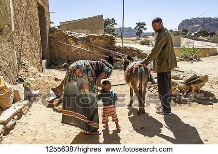 Stock Photograph - Ethiopian family and their donkey; Dugem, Tigray Region, Ethiopia. Fotosearch