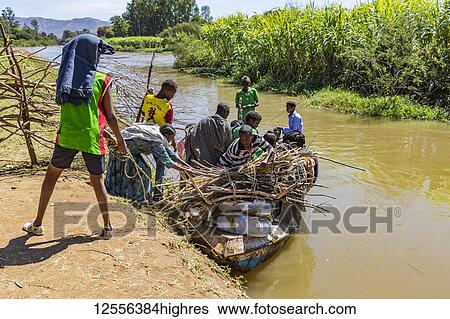 Ethiopian people boarding a boat on the Blue Nile River; Amhara Region, Ethiopia View Large Photo Image Stock Photograph - Ethiopian people boarding a boat on the Blue Nile River; Amhara Region, Ethiopia. Fotosearch