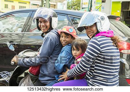 Family riding a motorcycle; Phnom Penh, Cambodia View Large Photo Image Stock Photograph - Family riding a motorcycle; Phnom Penh, Cambodia. Fotosearch