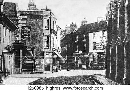 Stock Photograph - Faringdon village street scene depicting the Volunteer Inn and various shops, magic lantern slide circa 1900; Faringdon, Oxfordshire, England. Fotosearch