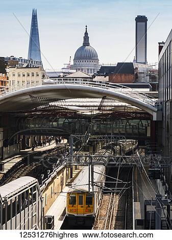 Stock Photograph - Farringdon Station, The Shard and St. Paul's Cathedral; London, England. Fotosearch