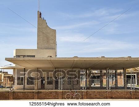 Stock Photograph - Fiat Tagliero Building, a Futurist-style service station, designed by the Italian engineer Giuseppe Pettazzi in 1938; Asmara, Central Region, Eritrea. Fotosearch