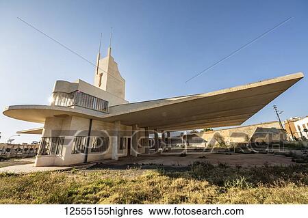 Stock Photograph - Fiat Tagliero Building, a Futurist-style service station, designed by the Italian engineer Giuseppe Pettazzi in 1938; Asmara, Central Region, Eritrea. Fotosearch