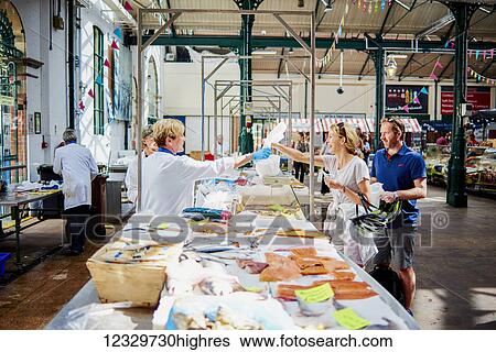 Stock Photograph - Fish Monger At St George's Market; Belfast, Ireland. Fotosearch