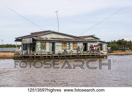 Stock Photograph - Floating house on the Tonle Sap; Siem Reap, Cambodia. Fotosearch