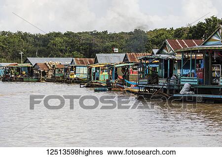 Stock Photograph - Floating houses on the Tonle Sap; Siem Reap, Cambodia. Fotosearch