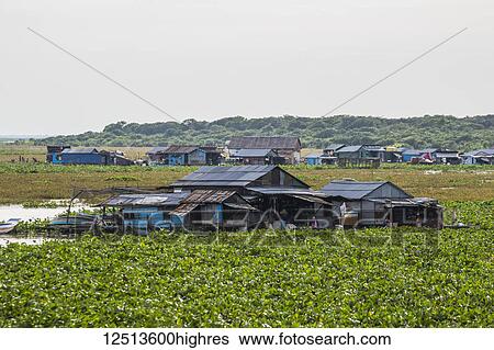 Stock Photograph - Floating village in the Tonle Sap; Siem Reap, Cambodia. Fotosearch