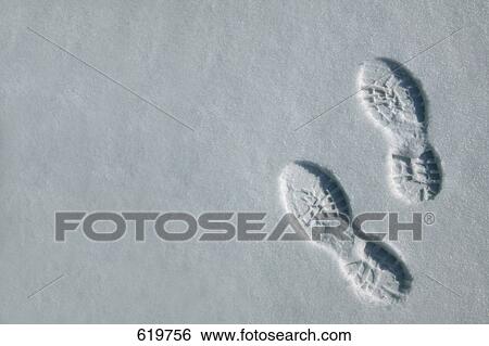 Stock Photograph - Foot prints in the snow. Fotosearch