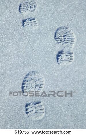 Stock Photography - Foot prints in the snow. Fotosearch