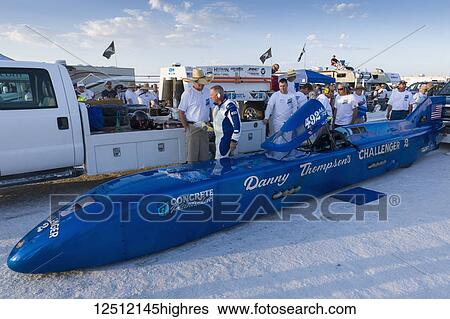 Stock Photograph - Fuel Streamliner Class AA/FS 1968 Thompson Streamliner of Danny Thompson on starting line on Bonneville Salt Flats of Bonneville Speed Week 2017 prepares to attack 406. 769 mph record; Wendover, Utah, United States of America. Fotosearch