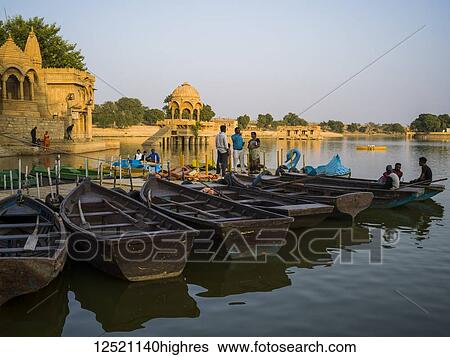 Stock Photograph - Gadsisar Sagar Lake, a manmade lake in the heart of Jaisalmer; Jaisalmer, Rajasthan, India. Fotosearch