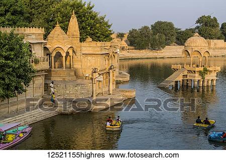 Stock Photograph - Gadsisar Sagar Lake, a manmade lake in the heart of Jaisalmer; Jaisalmer, Rajasthan, India. Fotosearch