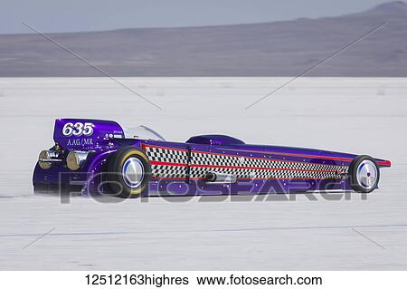 Stock Photograph - Gas Modified Roadster Class AA/GMR 1927 Ford Roadster 66 Dart V-8 at speed trying for records of 296. 180 mph on Bonneville Salt Flats during Bonneville Speed Week 2017; Wendover, Utah, United States of America. Fotosearch