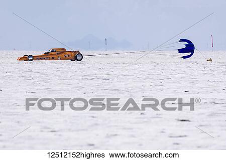 Stock Photograph - Gas Rear Engine Modified Roadster Class AA/GRMR 1927 Ford Roadster 600 Ford V-8 pops chute after attempt at 257. 612 mph record on Bonneville Salt Flats during Bonneville Speed Week 2017; Wendover, Utah, United States of America. Fotosearch