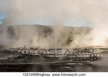Geysers and tourists on the boardwalk in Norris Basin in Yellowstone Park; Wyoming, United States of America View Large Photo Image Stock Photograph - Geysers and tourists on the boardwalk in Norris Basin in Yellowstone Park; Wyoming, United States of America. Fotosearch