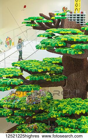 Girl looking over giant Lego tree in the Lego House; Billund, Denmark View Large Photo Image Stock Photograph - Girl looking over giant Lego tree in the Lego House; Billund, Denmark. Fotosearch
