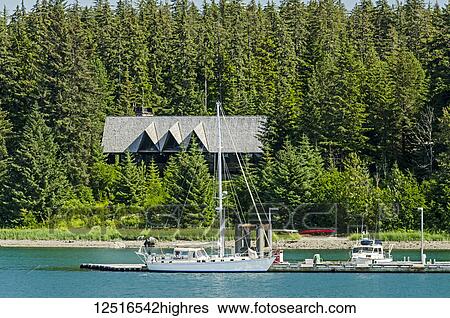 Stock Photograph - Glacier Bay Lodge and public use dock in Bartlett Cove, Glacier Bay National Park and Preserve, Southeast Alaska; Alaska, United States of America. Fotosearch
