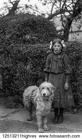 Glass Negative circa 1900. Victorian. Social History. A young girl with her dog in the street View Large Photo Image Stock Photograph - Glass Negative circa 1900. Victorian. Social History. A young girl with her dog in the street. Fotosearch