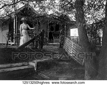 Glass Negative circa 1900. Victorian. Social History. A lady posing on the veranda of her home in the country View Large Photo Image Stock Photograph - Glass Negative circa 1900. Victorian. Social History. A lady posing on the veranda of her home in the country. Fotosearch