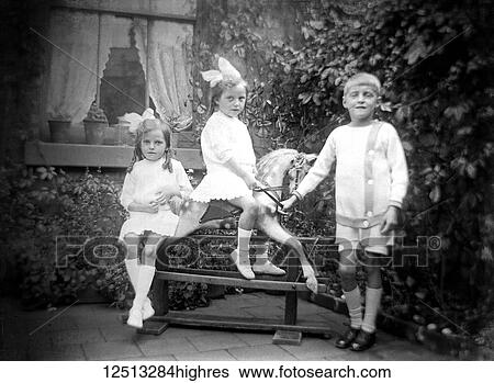 Glass Negative circa 1900. Victorian. Social History. Children playing on a rocking horse View Large Photo Image Stock Photograph - Glass Negative circa 1900. Victorian. Social History. Children playing on a rocking horse. Fotosearch
