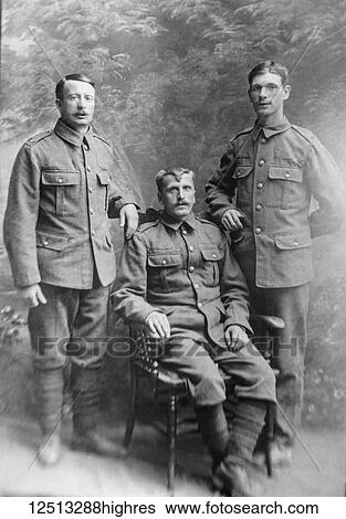 Stock Photograph - Glass Negative circa 1900. Victorian. Social History. WW1 soldiers posing. Soldiers from World War one in a family portrait. Fotosearch