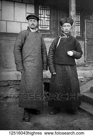 Stock Photograph - Glass Negative circa 1900. Victorian. Social History. Missionary in China with local inhabitant. Fotosearch
