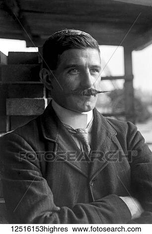 Stock Photograph - Glass Negative circa 1900. Victorian. Social History. Victorian man with handlebar moustache posing for photograph. Fotosearch
