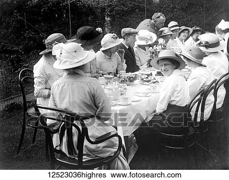 Stock Photograph - Glass Negative circa 1900. Victorian. Social History. Womens meeting in the garden having tea and scones. Fotosearch