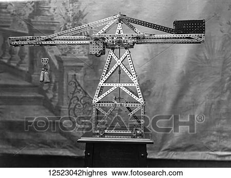 Stock Photograph - Glass Negative circa 1900. Victorian. Social History. Meccano crane with backdrop. Fotosearch
