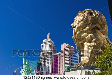 Golden lion sculpture, Statue of Liberty and New York building replicas in Las Vegas View Large Photo Image Stock Photograph - Golden lion sculpture, Statue of Liberty and New York building replicas in Las Vegas. Fotosearch
