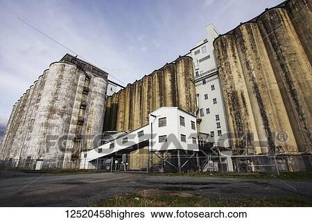 Stock Photograph - Grain silo and storage buildings in Halifax harbour; Halifax, Nova Scotia, Canada. Fotosearch