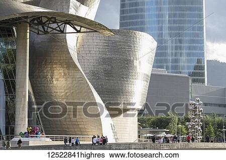 Stock Photograph - Guggenheim Museum, with Iberdrola Tower in background; Bilbao, Vizcaya, Pais Vasco, Euskadi, Spain. Fotosearch