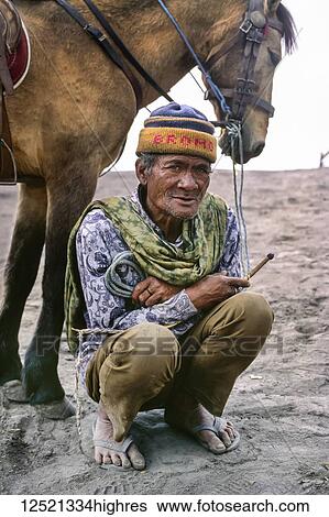 Guide with horse near Mount Brumo Volcano; Java, Indonesia View Large Photo Image Stock Photograph - Guide with horse near Mount Brumo Volcano; Java, Indonesia. Fotosearch