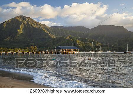 Stock Photograph - Hanalei Pier, bay and valley; Hanalei, Kauai, Hawaii, United States of America. Fotosearch