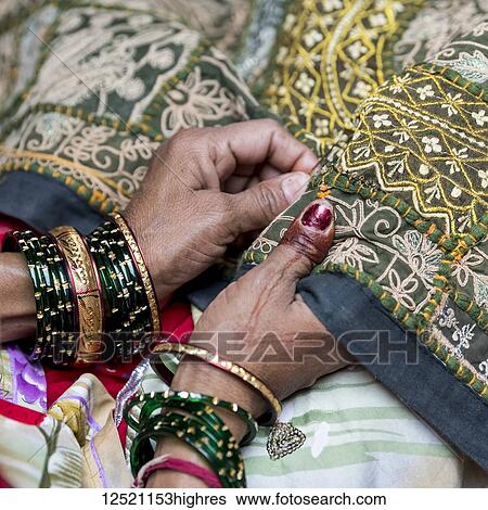 Hands of a seamstress at work; Jaisalmer, Rajasthan, India View Large Photo Image Stock Photograph - Hands of a seamstress at work; Jaisalmer, Rajasthan, India. Fotosearch